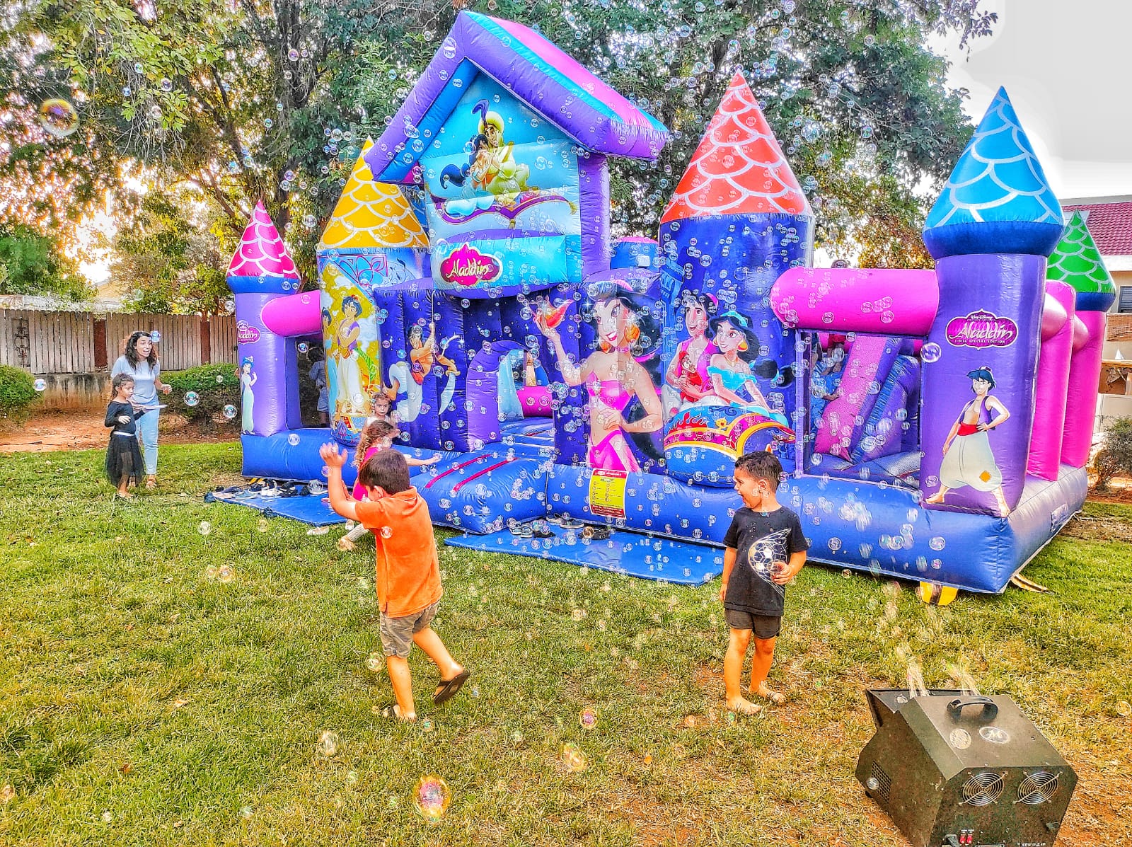 Inflatable slide set up outdoors at a children's birthday party in Israel